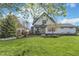 Charming two-story home with a well-manicured lawn and lovely landscaping at 7371 E 100 N, Whitestown, IN 46075