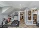 Gym area features a treadmill, free weights, and built-in shelving at 7371 E 100 N, Whitestown, IN 46075