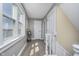 Bright hallway with neutral walls and a window providing ample natural light at 7371 E 100 N, Whitestown, IN 46075