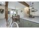 An open kitchen featuring a breakfast bar, stainless steel appliances, and shaker style cabinets at 7371 E 100 N, Whitestown, IN 46075