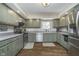 Kitchen with shaker cabinets, stainless appliances, wooden floors, and ample counter space at 7371 E 100 N, Whitestown, IN 46075