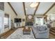Comfortable living room featuring a stone fireplace and open concept design at 7371 E 100 N, Whitestown, IN 46075