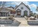 Inviting front patio featuring stone pavers, outdoor seating, and a charming view of the home's facade at 7371 E 100 N, Whitestown, IN 46075