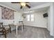 Versatile bonus room with sewing table, window view, and neutral carpeting at 7371 E 100 N, Whitestown, IN 46075