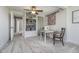 Bright bonus room with a sewing machine, storage shelves, and neutral carpeting at 7371 E 100 N, Whitestown, IN 46075