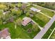 An aerial view showcases a home surrounded by a lush lawn, landscaping, and neighborhood at 7440 Graham Rd, Indianapolis, IN 46250
