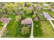 Aerial view of a home with an expansive lawn, surrounded by lush greenery at 7440 Graham Rd, Indianapolis, IN 46250