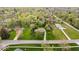 Aerial view displays the property's extensive lawn, mature trees, and surrounding neighborhood at 7440 Graham Rd, Indianapolis, IN 46250