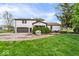 Spacious backyard featuring a well-manicured lawn, a two car garage, and patio space at 7440 Graham Rd, Indianapolis, IN 46250