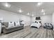 Finished basement boasts neutral tones, laminate flooring, and bonus bedroom area at 7440 Graham Rd, Indianapolis, IN 46250