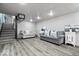 Finished basement features durable floors, modern lighting and comfortable seating at 7440 Graham Rd, Indianapolis, IN 46250
