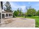 A large concrete driveway has a basketball hoop and leads to a sunroom with windows at 7440 Graham Rd, Indianapolis, IN 46250