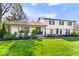 Charming two-story home with a well-manicured lawn, beautiful landscaping and brick accents at 7440 Graham Rd, Indianapolis, IN 46250