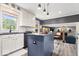 This eat-in kitchen includes views of the living room and stone fireplace creating a shared living space at 7440 Graham Rd, Indianapolis, IN 46250