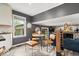 This bright kitchen includes an island eating space and views of the living room with stone fireplace at 7440 Graham Rd, Indianapolis, IN 46250