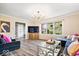 Spacious living room featuring large windows, stylish decor, and sleek flooring at 7440 Graham Rd, Indianapolis, IN 46250