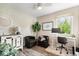 Cozy home office with brick accent wall, comfortable chairs, and a well-lit workspace at 7440 Graham Rd, Indianapolis, IN 46250