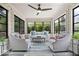 Bright sunroom featuring lots of natural light, modern ceiling fan and seating at 7440 Graham Rd, Indianapolis, IN 46250