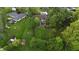 Aerial view of the home's expansive, green lawn, showcasing mature trees and outbuildings at 8035 Black Oak Ct, Plainfield, IN 46168