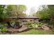 Beautiful backyard featuring a brick patio, lovely landscaping and outdoor seating area at 8035 Black Oak Ct, Plainfield, IN 46168