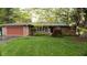 Charming brick ranch home featuring an attached two-car garage and lush green front lawn at 8035 Black Oak Ct, Plainfield, IN 46168
