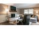 Inviting living room featuring a fireplace, comfortable seating, and natural light at 8035 Black Oak Ct, Plainfield, IN 46168