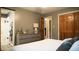Well-lit main bedroom with a dresser and an open ensuite bathroom for added convenience at 8035 Black Oak Ct, Plainfield, IN 46168
