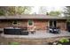The brick home has a concrete patio, nice outdoor furniture and dining table at 8035 Black Oak Ct, Plainfield, IN 46168