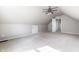 Attic featuring carpeted floor, ceiling fan, and access door at 8142 Bittern Ln, Indianapolis, IN 46256