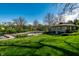 A lush backyard features a pool, playground, and well-maintained landscaping creating an inviting outdoor space at 8142 Bittern Ln, Indianapolis, IN 46256
