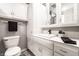 Bright bathroom featuring white cabinets, modern fixtures and a clean, well-lit vanity area at 8142 Bittern Ln, Indianapolis, IN 46256