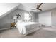 Comfortable bedroom featuring neutral carpet, a ceiling fan, and side table with lamps at 8142 Bittern Ln, Indianapolis, IN 46256