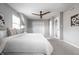 Spacious bedroom with neutral carpet, a ceiling fan, and double closets at 8142 Bittern Ln, Indianapolis, IN 46256