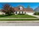 Charming single-Gathering home featuring a well-manicured lawn, complementary landscaping, and a two-car garage at 8142 Bittern Ln, Indianapolis, IN 46256