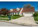 Attractive home with manicured lawn, neatly trimmed shrubs, asphalt driveway, and convenient mailbox at 8142 Bittern Ln, Indianapolis, IN 46256