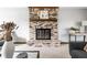 Close-up of the charming brick fireplace with a decorative mantel and hearth at 8142 Bittern Ln, Indianapolis, IN 46256