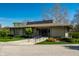 Charming home exterior featuring accessible ramp, landscaped front yard, and welcoming entrance at 8142 Bittern Ln, Indianapolis, IN 46256