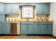 Detailed view of the kitchen's blue cabinetry and butcher block countertops at 8142 Bittern Ln, Indianapolis, IN 46256