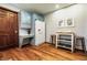 Cozy kitchen with a built-in desk, stainless steel stools, and white refrigerator at 8142 Bittern Ln, Indianapolis, IN 46256