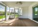 Cozy screened-in porch offering serene outdoor living with wood floors, and views of the yard at 8142 Bittern Ln, Indianapolis, IN 46256