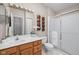 Well-maintained bathroom with a shower, sink, and tiled floors at 8410 Glenwillow Ln # 208, Indianapolis, IN 46278