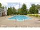 Sparkling community pool offers a relaxing oasis with lounge chairs for residents' enjoyment at 8410 Glenwillow Ln # 208, Indianapolis, IN 46278