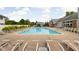 Large community pool with lounge chairs and shade offers residents relaxation and recreation at 8410 Glenwillow Ln # 208, Indianapolis, IN 46278