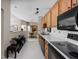 Well-equipped kitchen with an open layout offering views into the dining area at 8410 Glenwillow Ln # 208, Indianapolis, IN 46278
