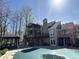 Backyard features a pool with a large deck, screened porch, and plenty of room for entertaining at 8502 Jib Ct, Indianapolis, IN 46236
