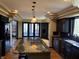 Spacious kitchen features dark wood cabinets, granite countertops, and stainless steel appliances at 8502 Jib Ct, Indianapolis, IN 46236