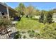 Manicured backyard with lush lawn, mature trees, and landscape beds creating a serene setting at 8830 Kipling Dr, Indianapolis, IN 46239