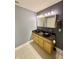 This bathroom showcases a double vanity with granite counters and vessel sinks at 8830 Kipling Dr, Indianapolis, IN 46239