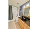Bathroom features stylish vessel sink and shower-tub combo at 8830 Kipling Dr, Indianapolis, IN 46239