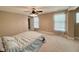 Bright bedroom with a ceiling fan, and carpet, creating a relaxing and comfortable space at 8830 Kipling Dr, Indianapolis, IN 46239